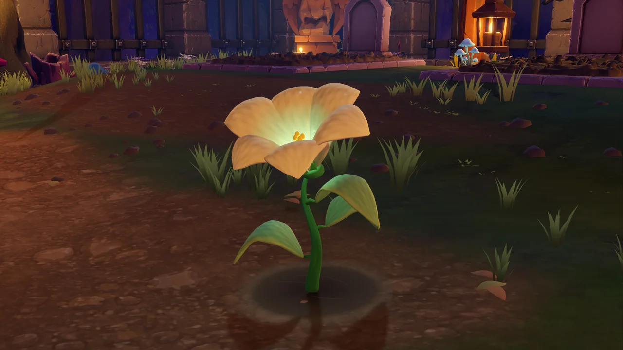 A pale yellow Moonbell flower glowing softly beside a cemetery path.